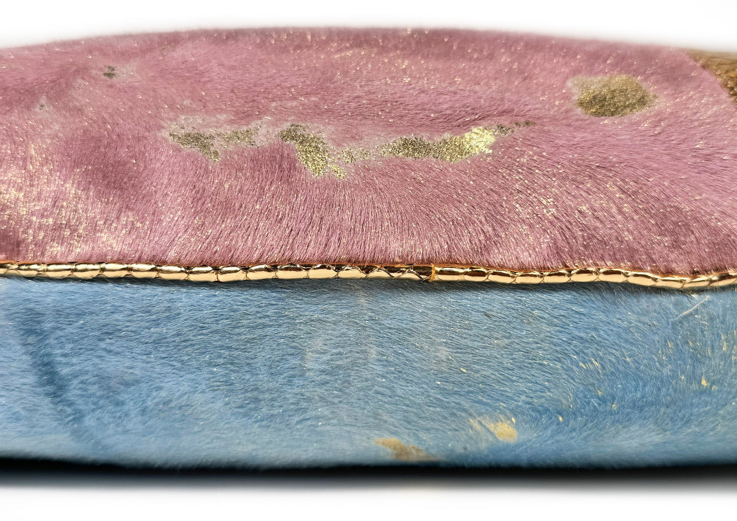 Detail of the gold python piping finishing the Lolita luxury cushion, handmade in Romania.