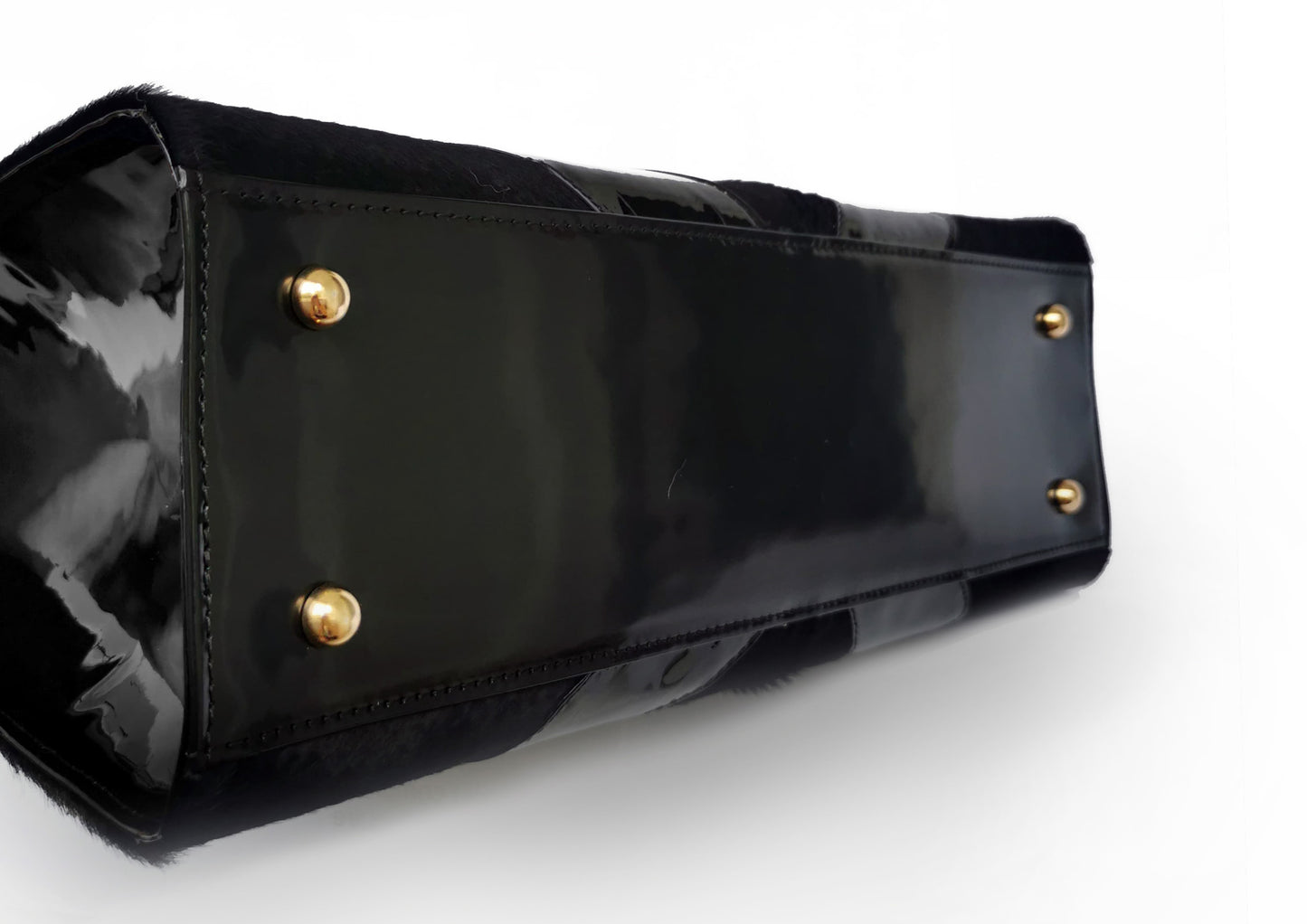 Elegant black handbag with python skin and pony leather details, handmade in Bucharest, Romania.