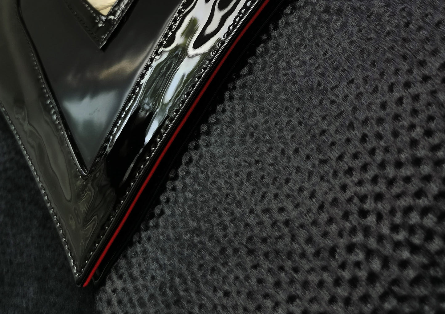 Elegant black handbag with python skin and pony leather details, handmade in Bucharest, Romania.