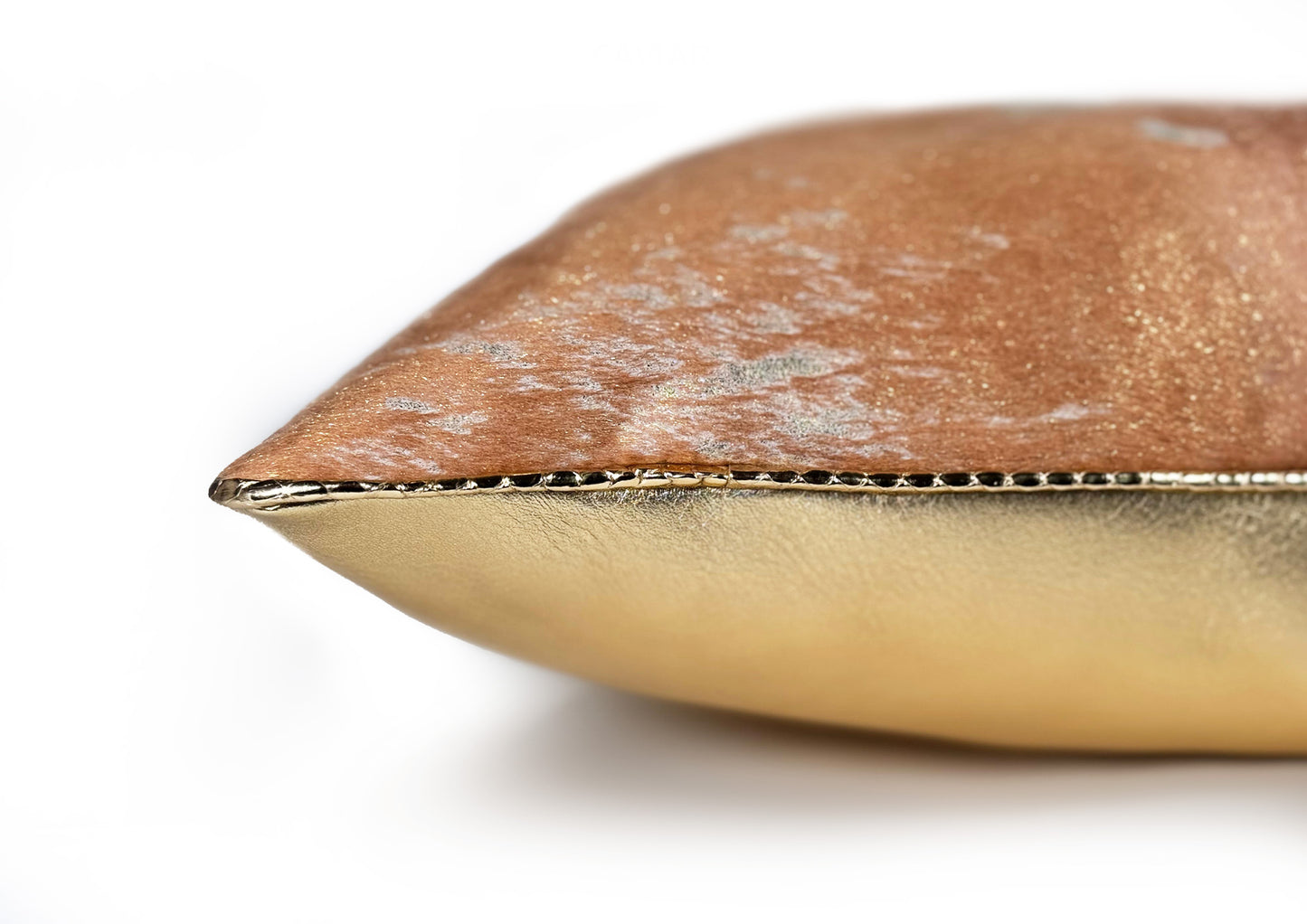 Detail of the gold python piping finishing the Amber Crown Small luxury cushion.