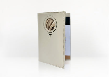 Angled view of the Carte du Jeu golf scorecard holder – handcrafted in matte light beige calfskin with natural python insert and refined stitching.
