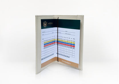 Interior of the Carte du Jeu golf scorecard holder showing card and pencil compartments, handcrafted in beige calf leather with python insert.