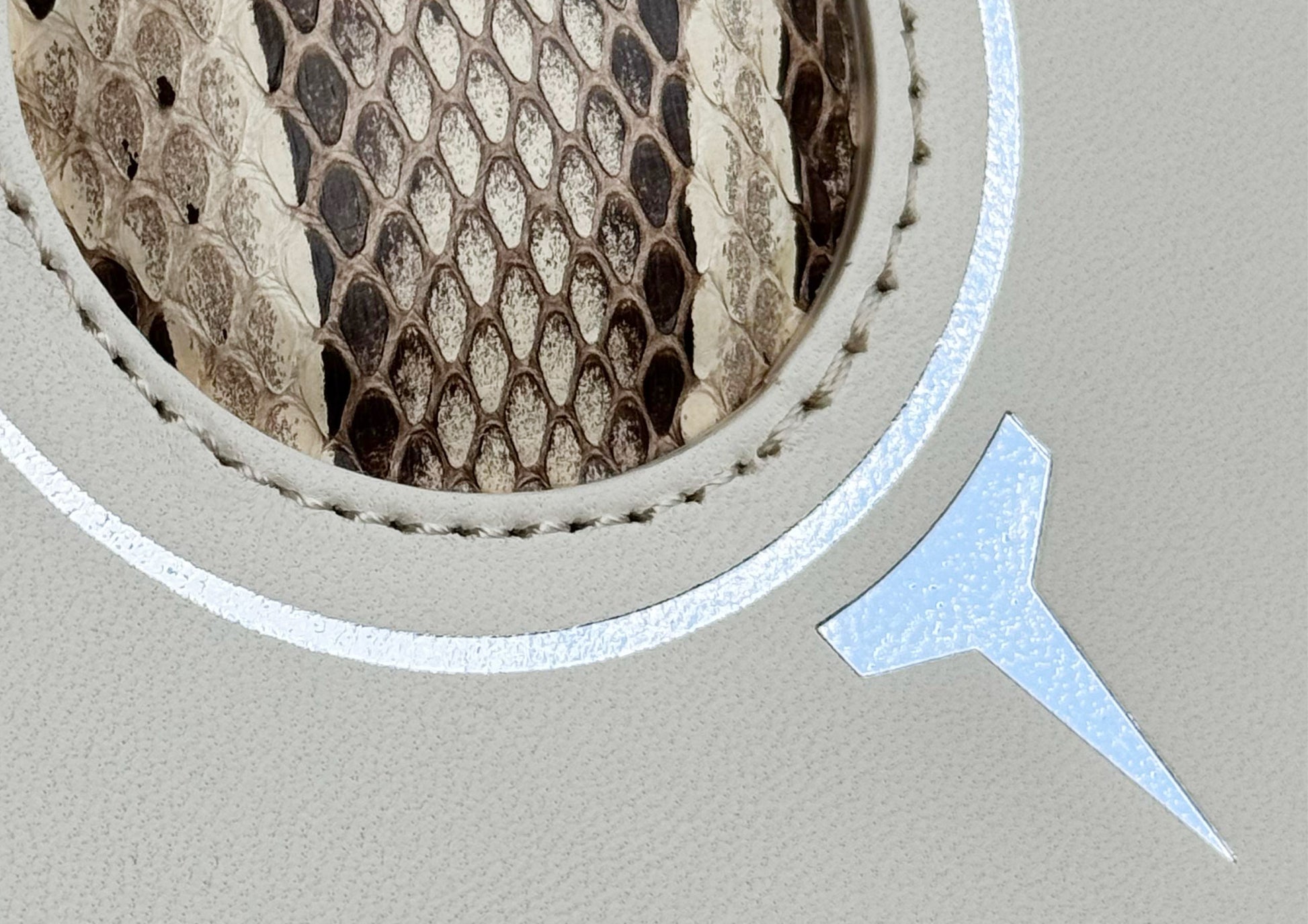 Close-up of the natural python insert and detailed stitching on the Carte du Jeu luxury golf scorecard holder, part of MFL’s Champagne & Fairways collection.