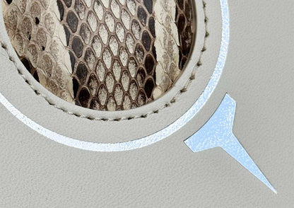 Close-up of the natural python insert and detailed stitching on the Carte du Jeu luxury golf scorecard holder, part of MFL’s Champagne & Fairways collection.