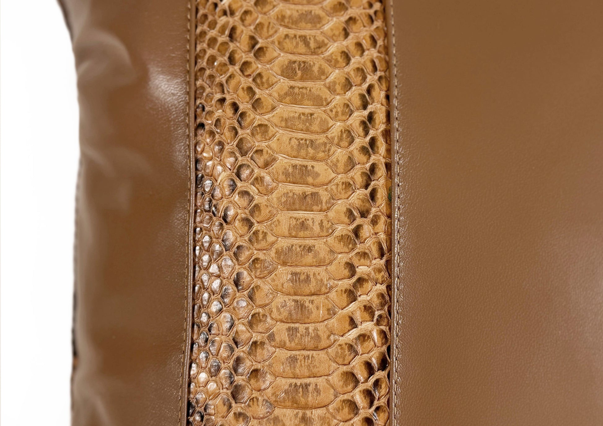 : Close-up of the Golden Sand goat leather texture from the Dune Large cushion.