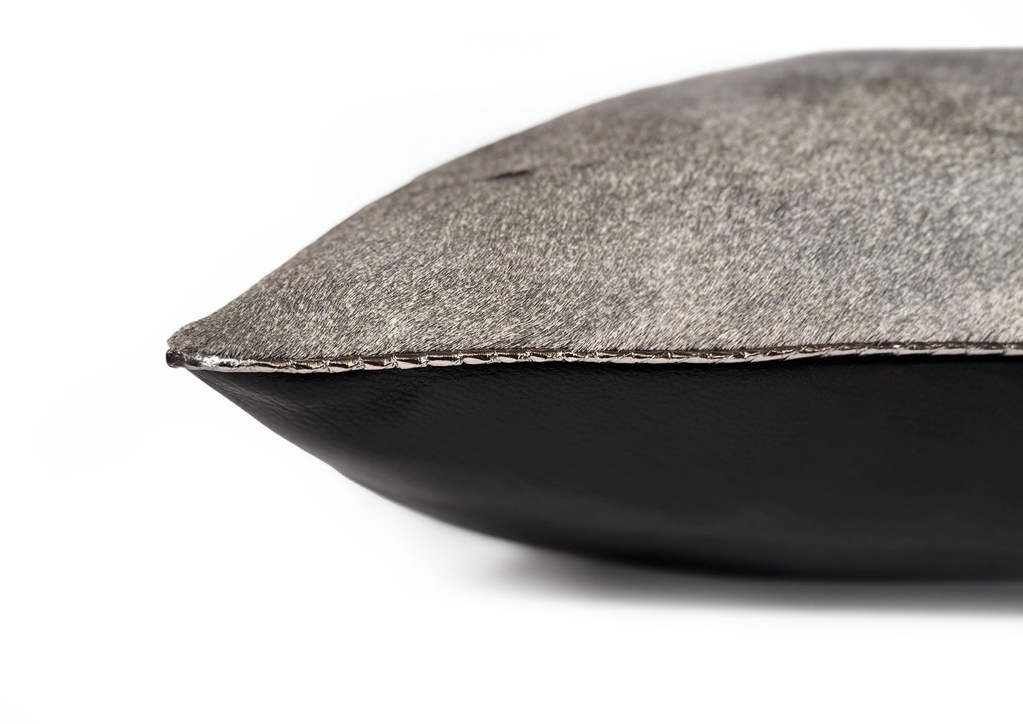 Fine hand stitching detail on the Metropolitan Large Square cushion, showing craftsmanship and precise finishing.