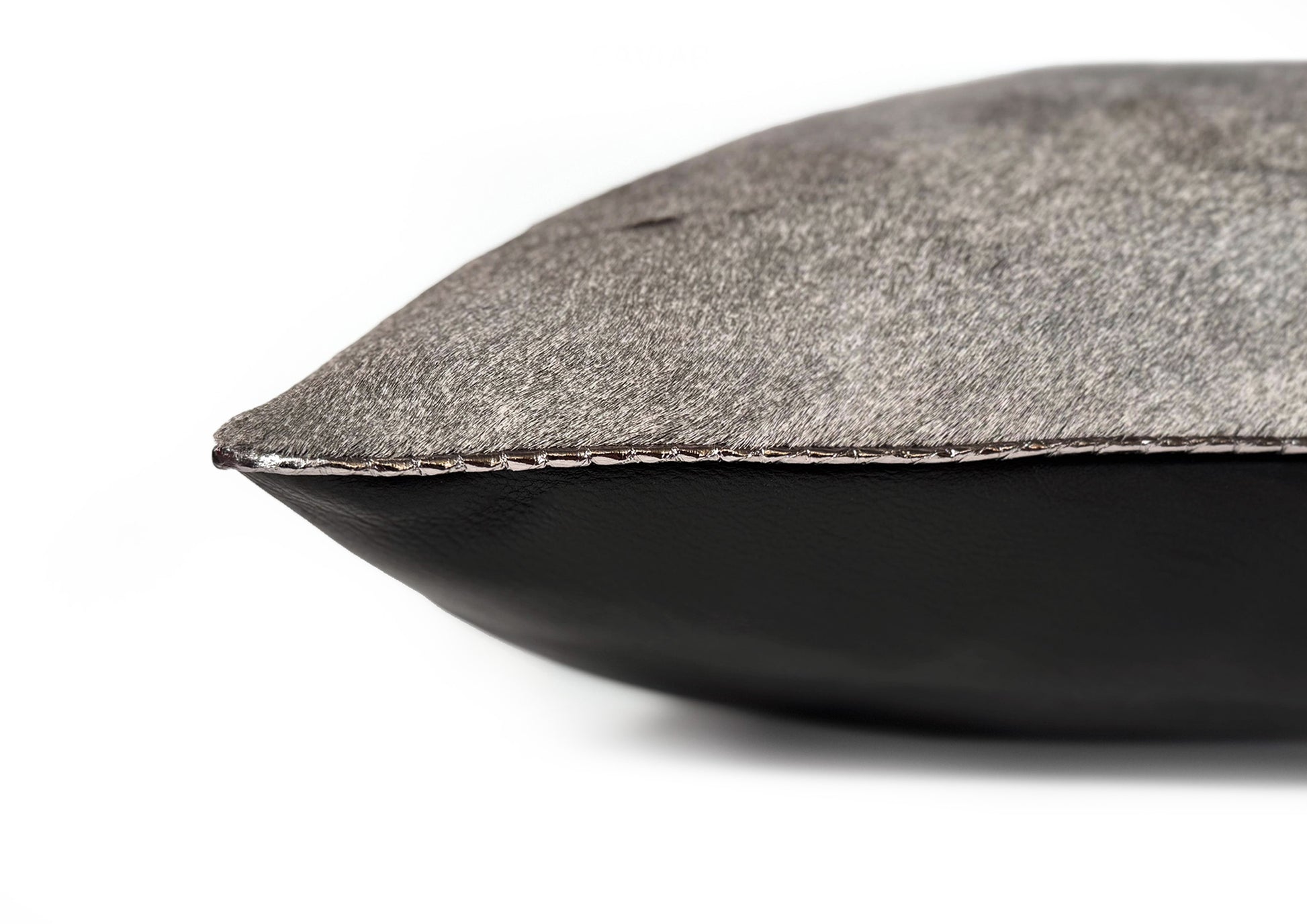 Fine hand stitching detail on the Metropolitan Large Square cushion, showing craftsmanship and precise finishing.