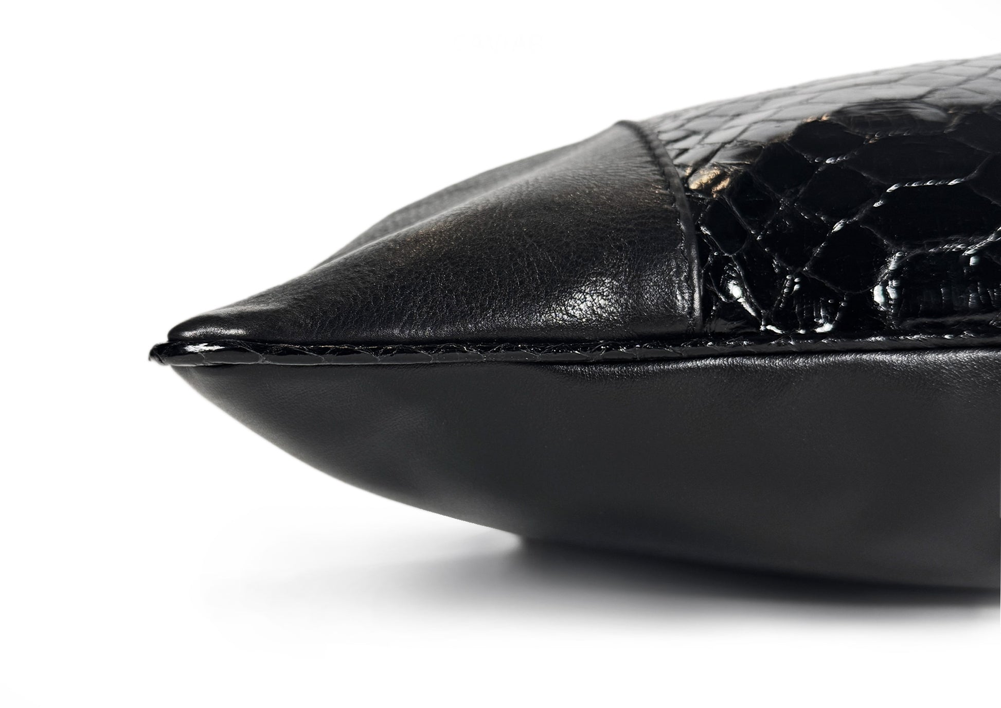 Fine hand stitching detail on the Obsidian Large cushion, showing precision and artisanal craftsmanship.