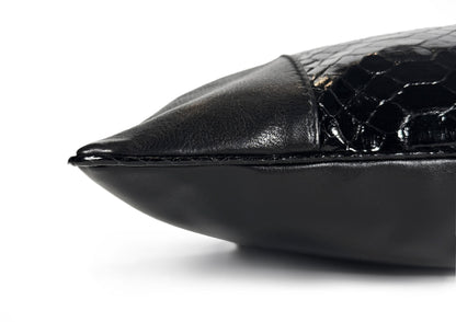 Detail of the glazed black python piping finishing the Obsidian Small luxury cushion.