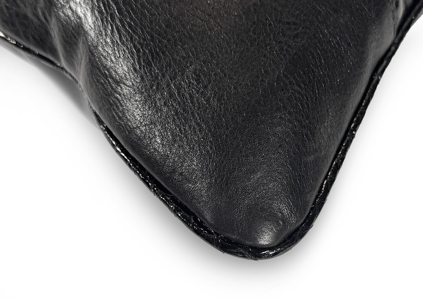 Fine hand stitching detail on the Obsidian Small cushion, showing craftsmanship and precision.