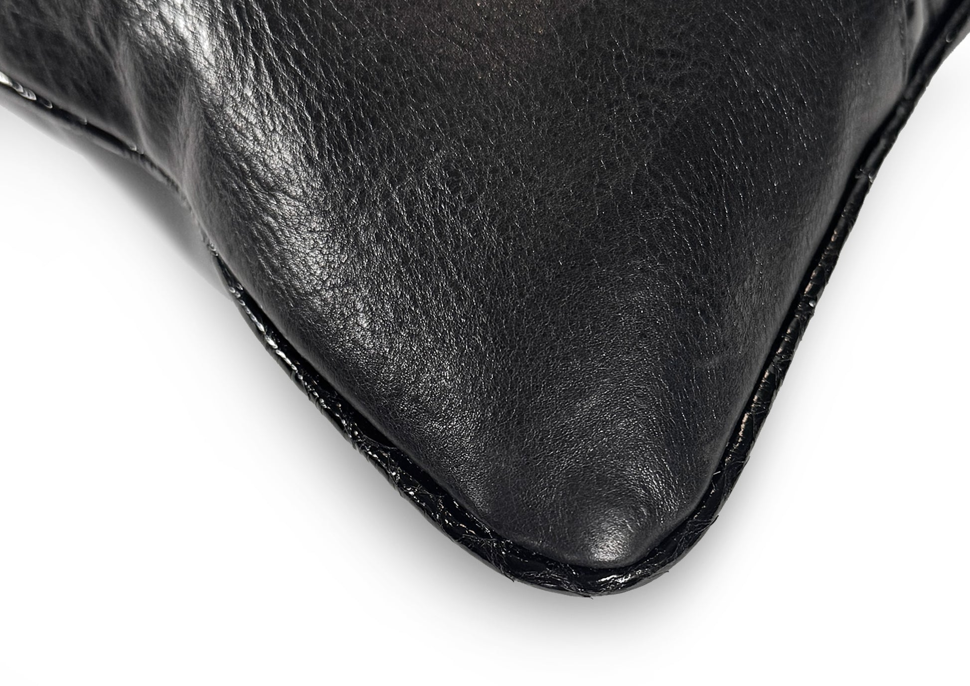 Fine hand stitching detail on the Obsidian Small cushion, showing craftsmanship and precision.