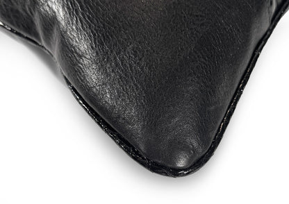 Fine hand stitching detail on the Obsidian Small cushion, showing craftsmanship and precision.