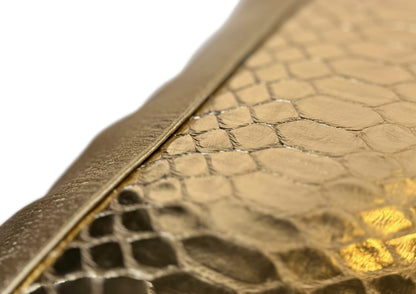 Close-up of the golden python leather insert on the Royal Honey Large cushion, showing glazed finish and metallic glow.