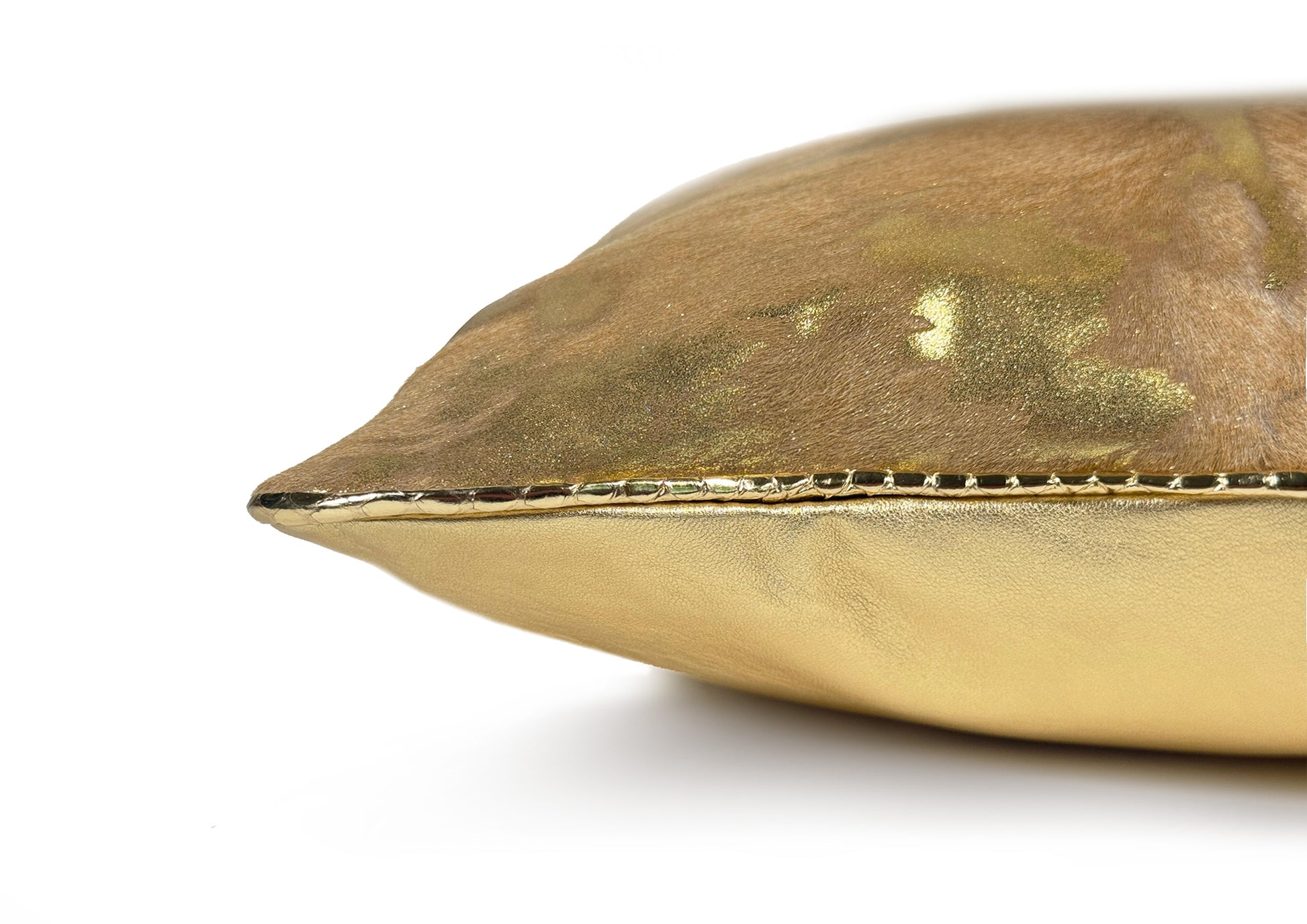 Detail of the gold python piping framing the Royal Honey Small luxury cushion.