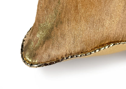 Close-up of the gold patina calf hair-on-hide texture from the Royal Honey Small cushion.