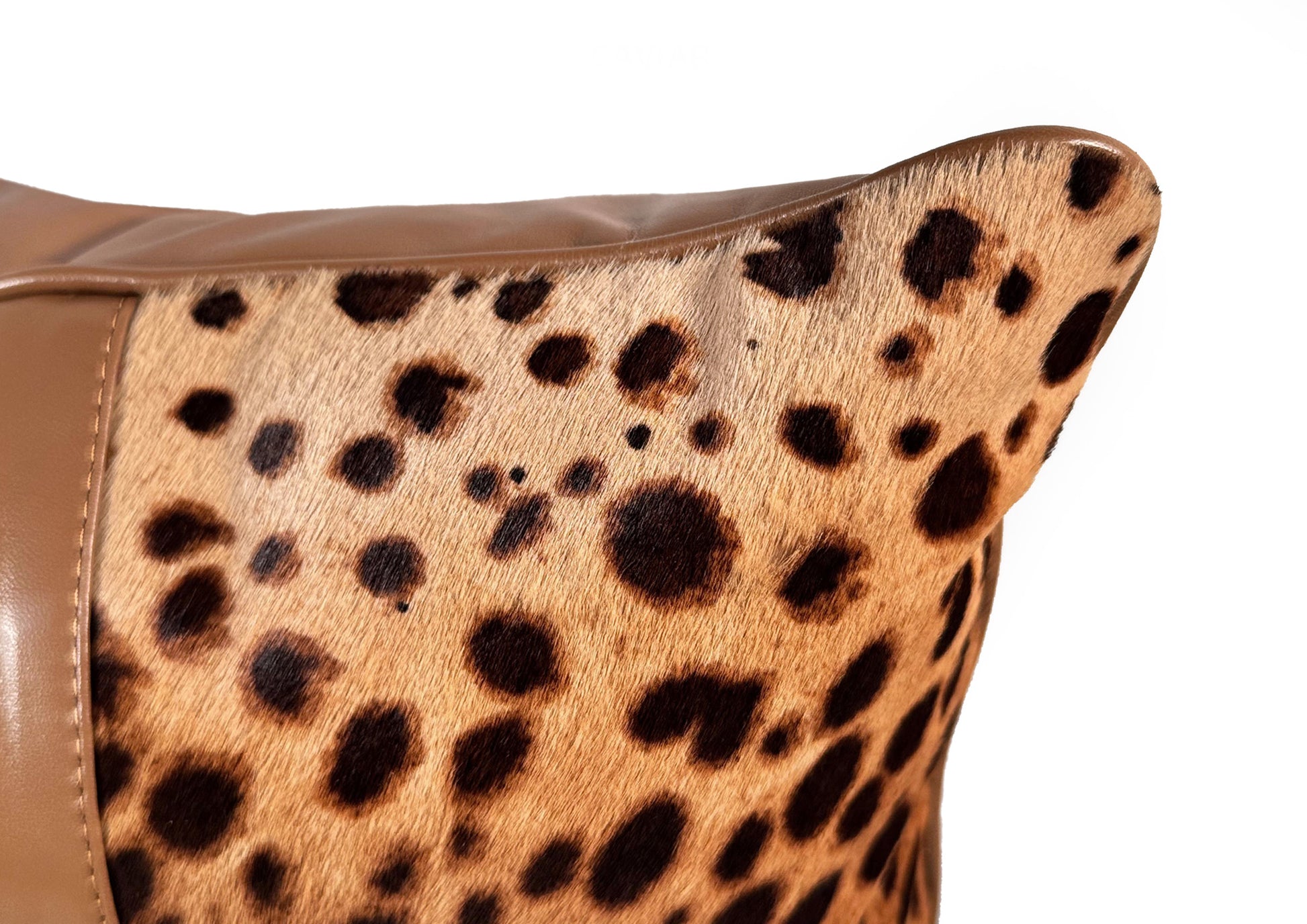 Close-up of the natural leopard hair-on-hide texture on the Savannah Grande luxury cushion.