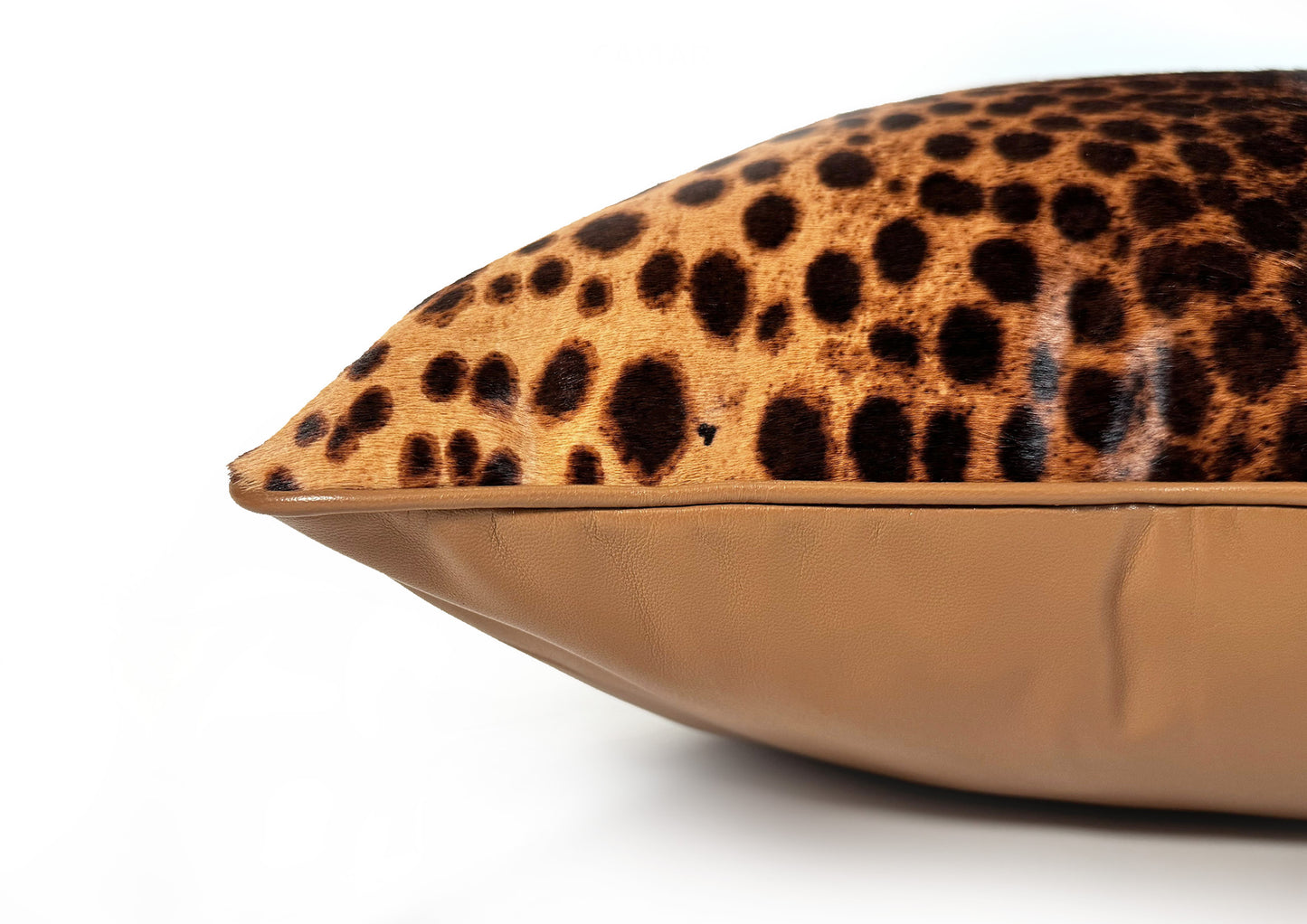 Close-up of the natural leopard hair-on-hide calf leather texture on the Savannah II decorative cushion.