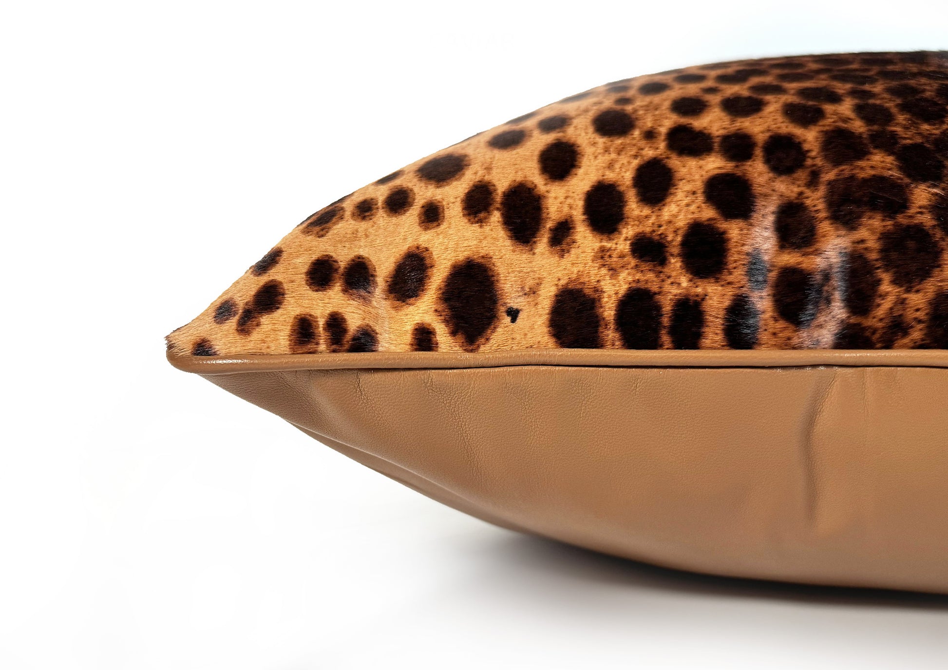 Close-up of the natural leopard hair-on-hide calf leather texture on the Savannah II decorative cushion.
