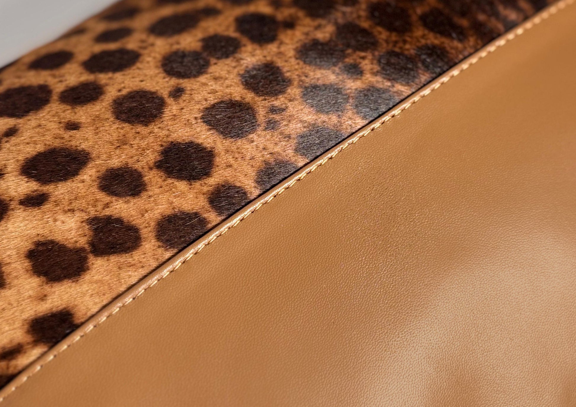 Close-up of the fine hand stitching on the Savannah Large II luxury cushion, showing the craftsmanship and attention to detail.