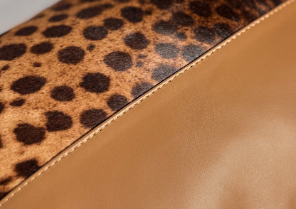 Close-up of the fine hand stitching on the Savannah Large II luxury cushion, showing the craftsmanship and attention to detail.