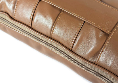Close-up of the woven Terracotta Tan goat leather on the Terracotta Stripe Small cushion.