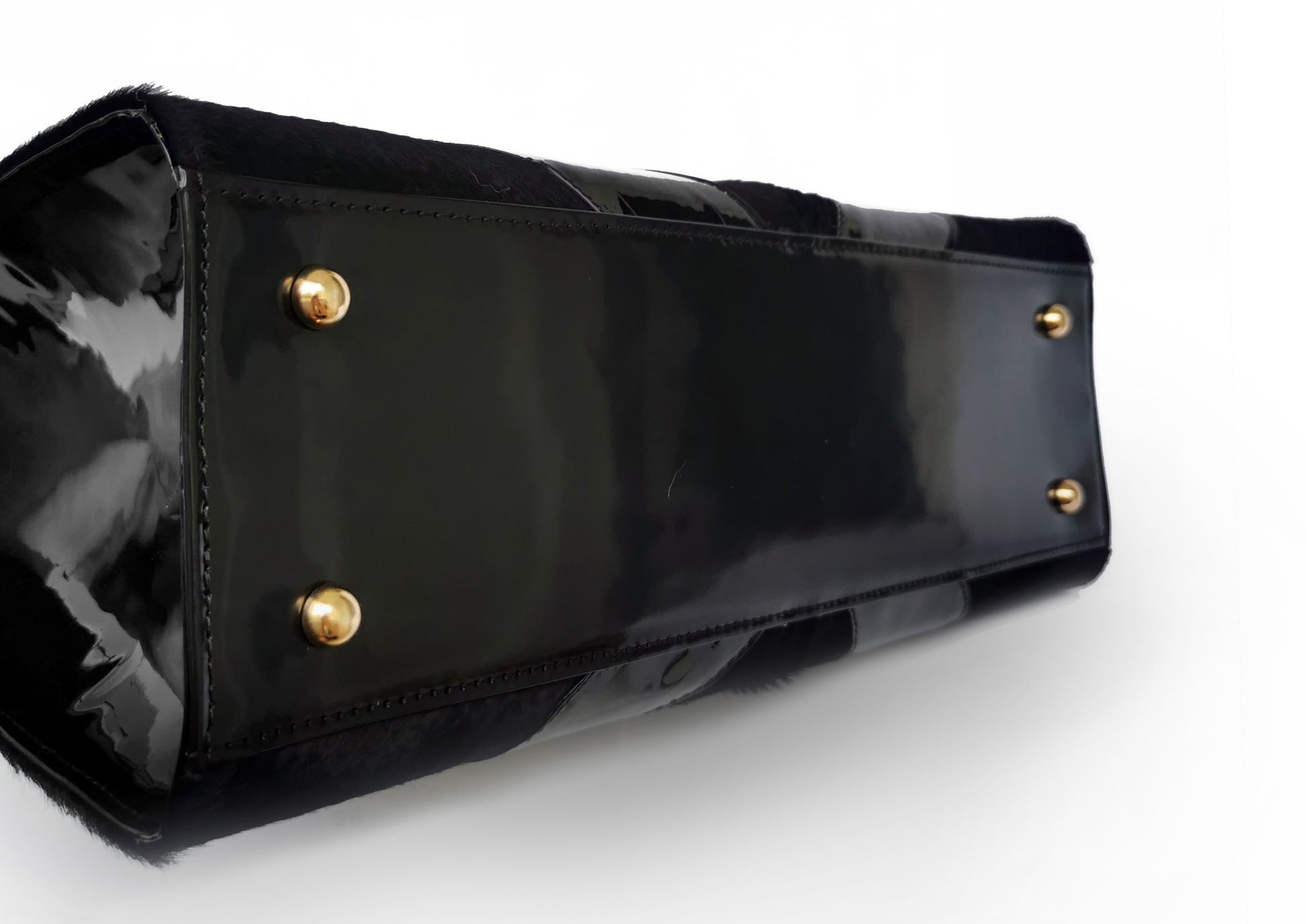Elegant black handbag with python skin and pony leather details, handmade in Bucharest, Romania.